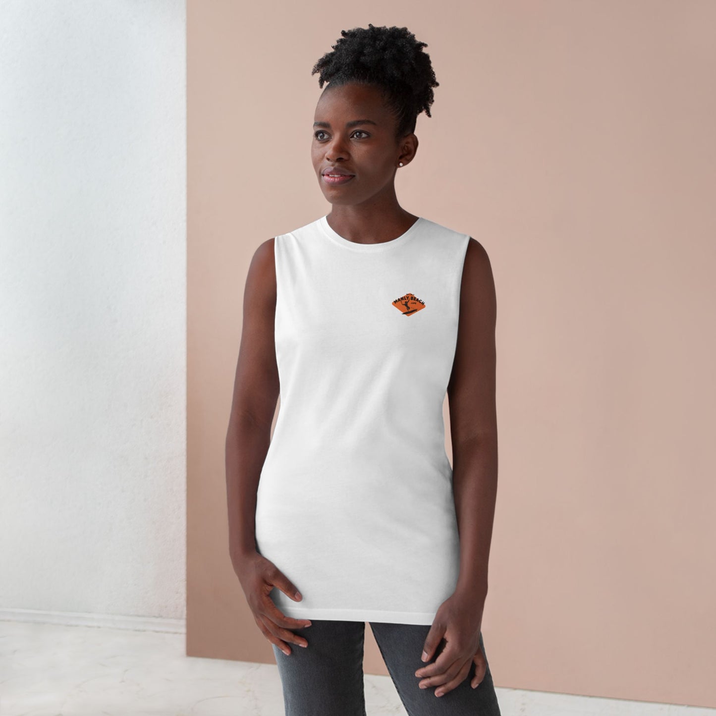 Woman in white sleeveless tee with orange logo