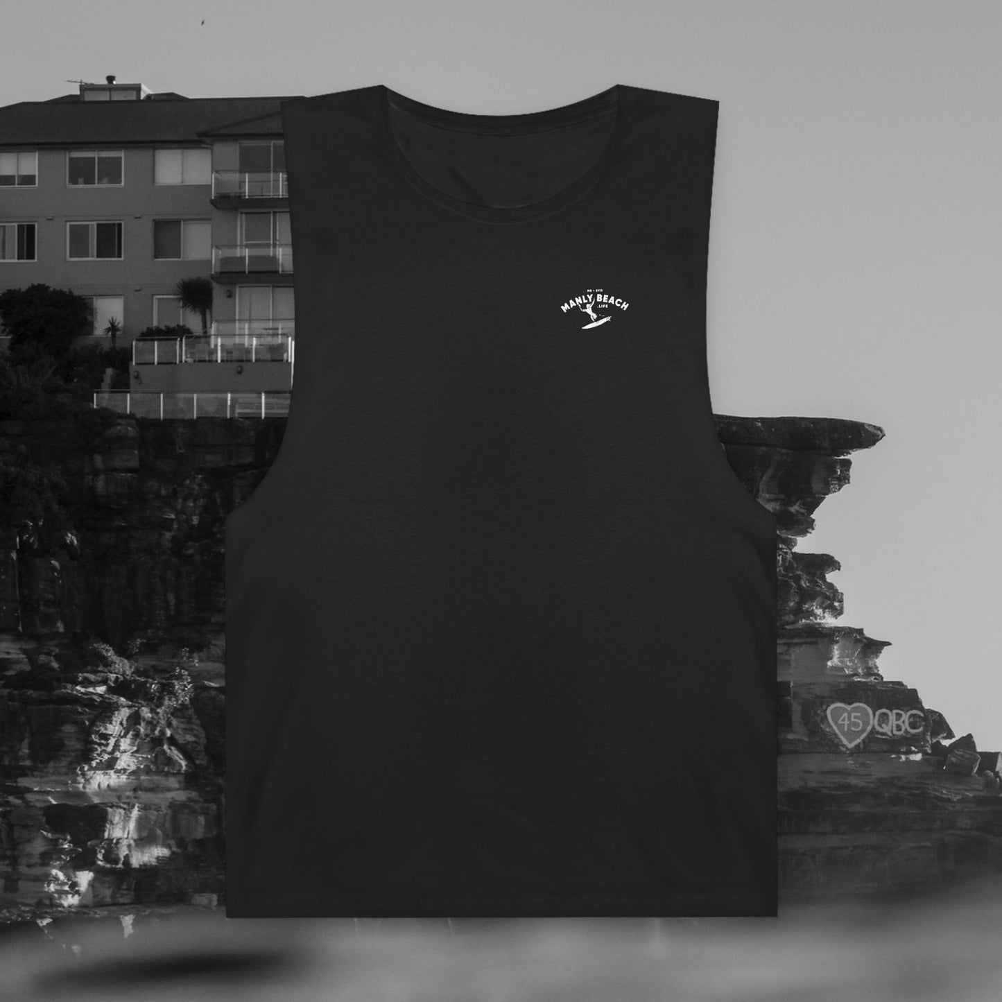 White tee with circular black graphic.