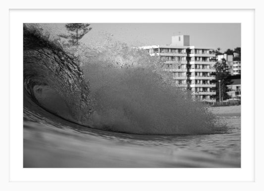 B&W framed wave print.