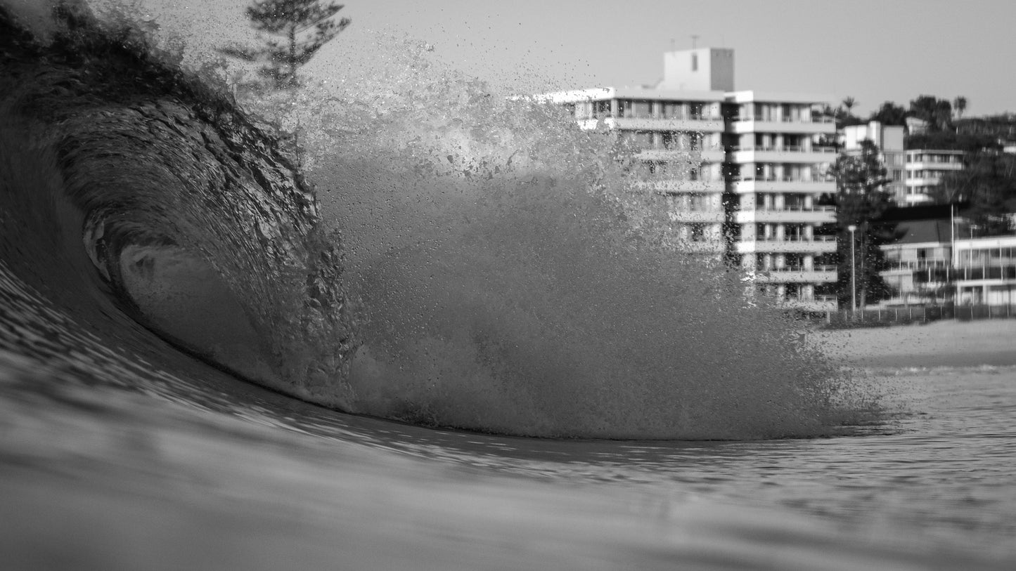 Black-and-white barreling wave.