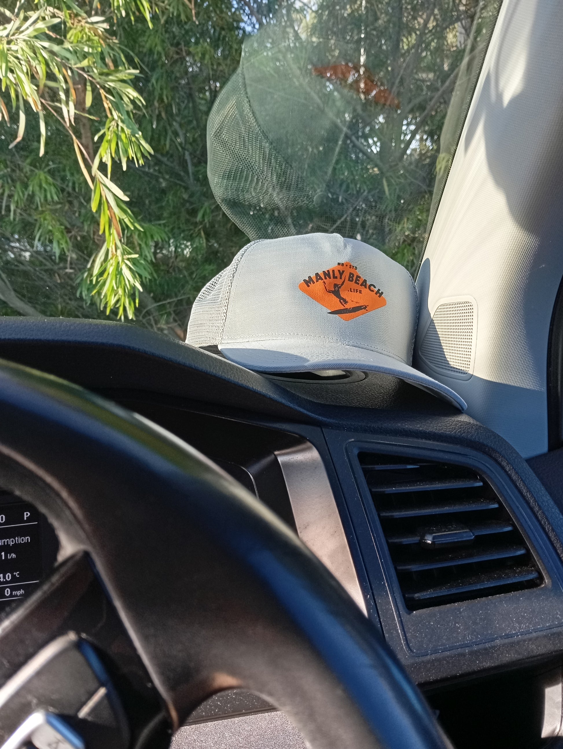 Sunset beach with surfboard silhouette.